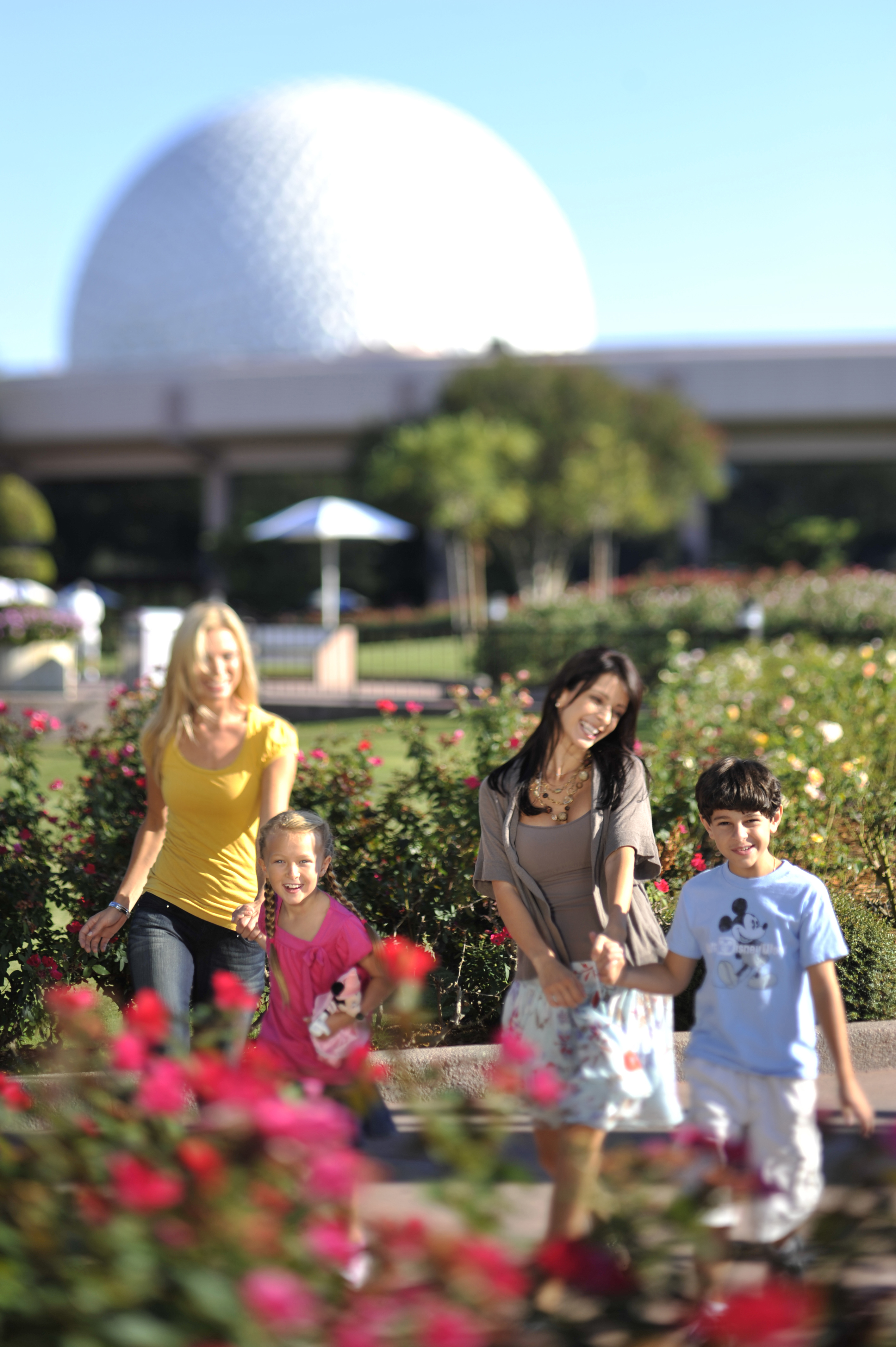 Celebrate Mother's Day, Orlando, two mothers with kids walking through Epcot