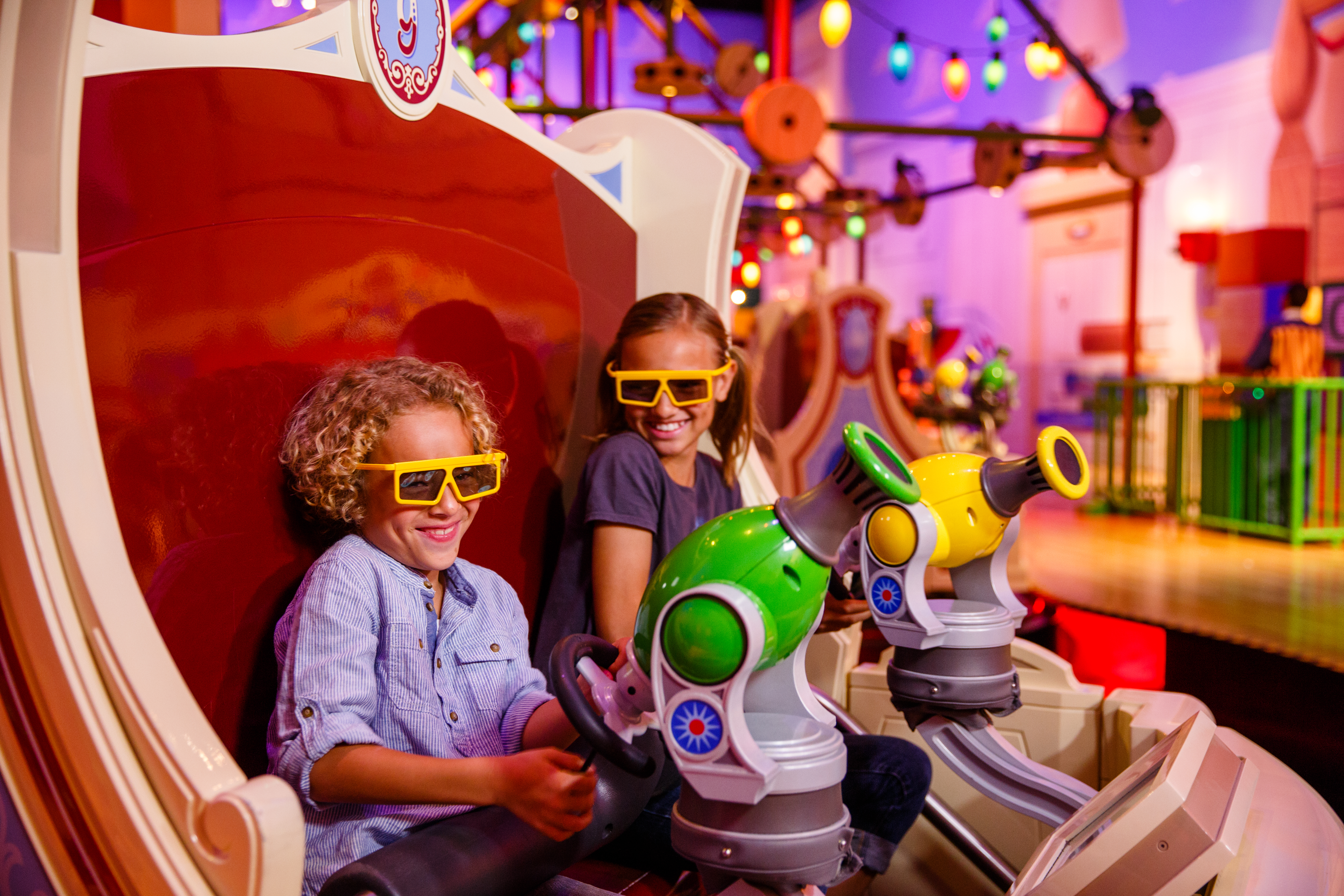 Two children play on the Toy Story Mania ride at Disney's Hollywood Studios.