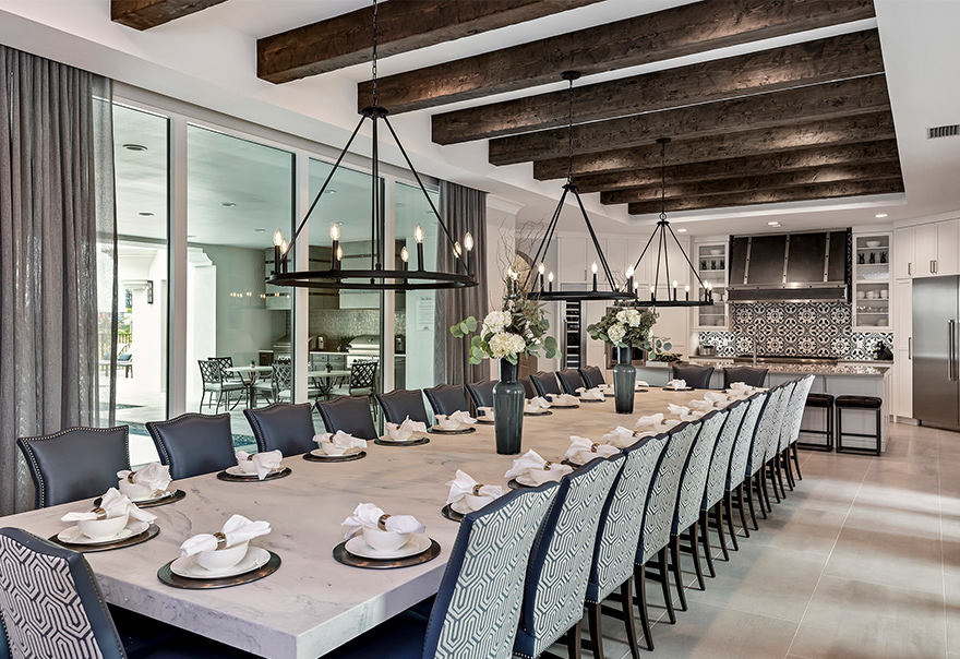Dining table in RVH_385 showcased to emphasize plenty of room for corporate retreats.