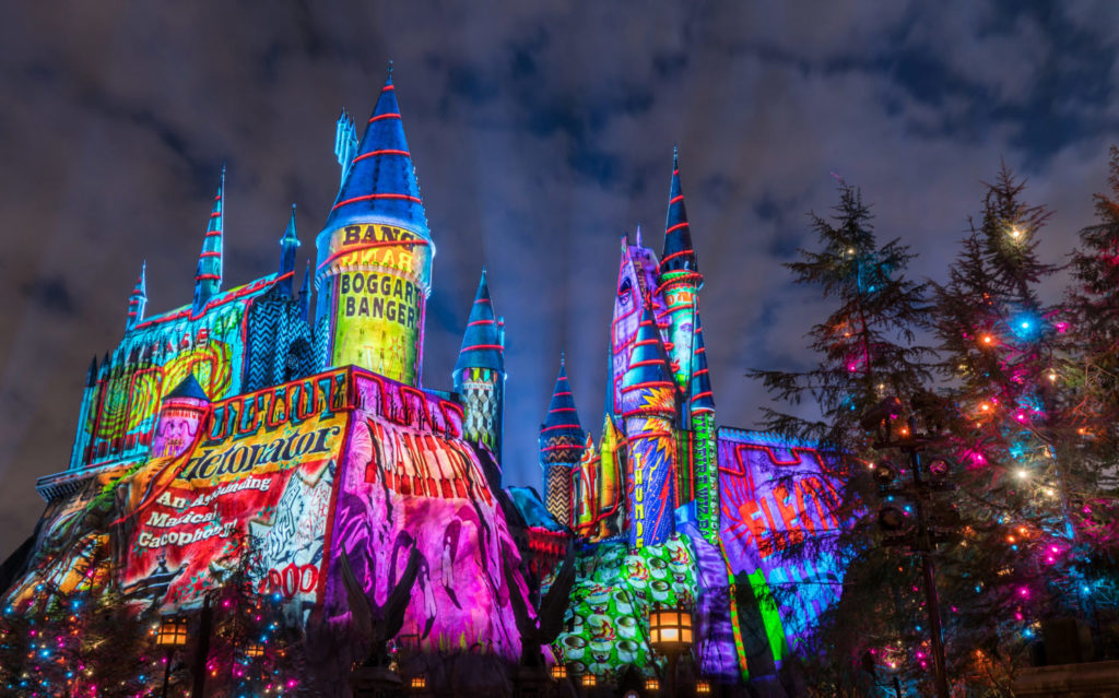 Nighttime shot of colorful holiday projection on the Hogwarts Castle in Universal's Islands of Adventure.