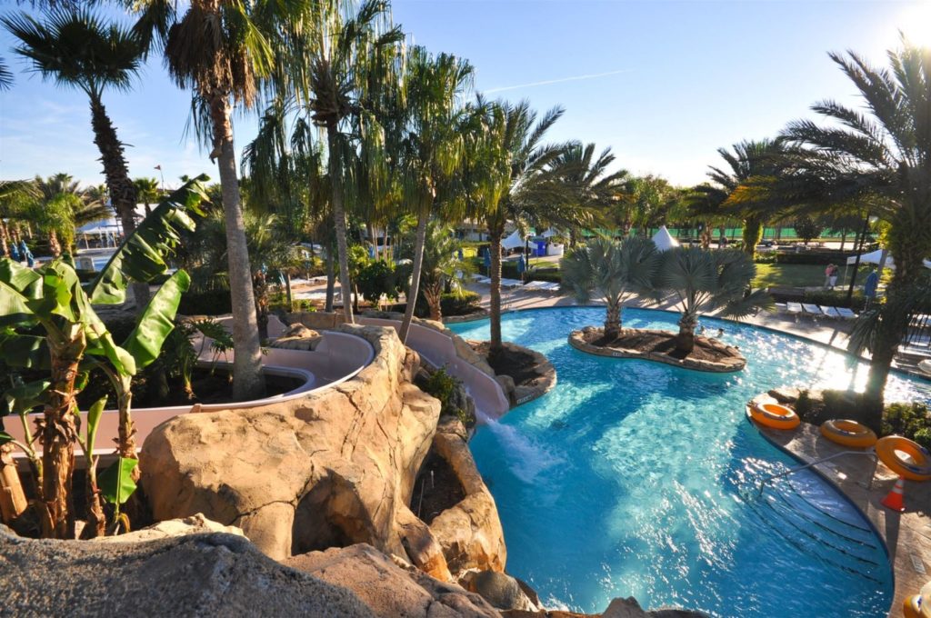 Daytime shot of pool and slide at Reunion Resort Water Park. Orlando, Florida.